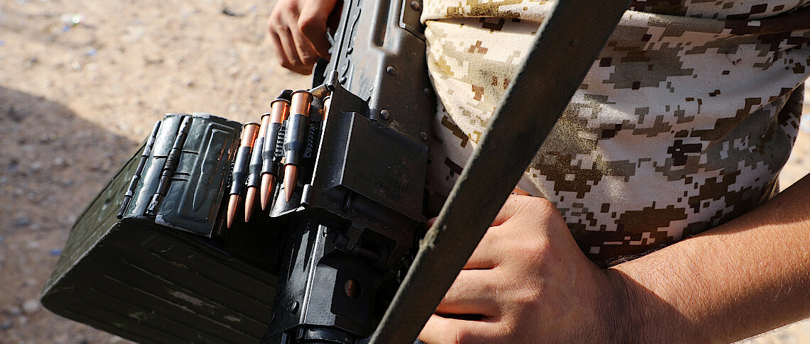 A member of the Libyan internationally recognised government forces carries a weapon Reuters