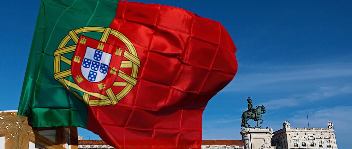 A Portuguese national flag flies above. EPA